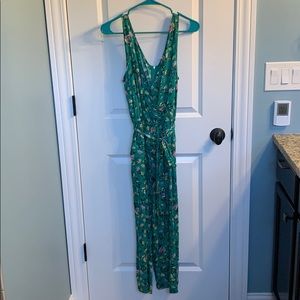 a green, floral jumpsuit